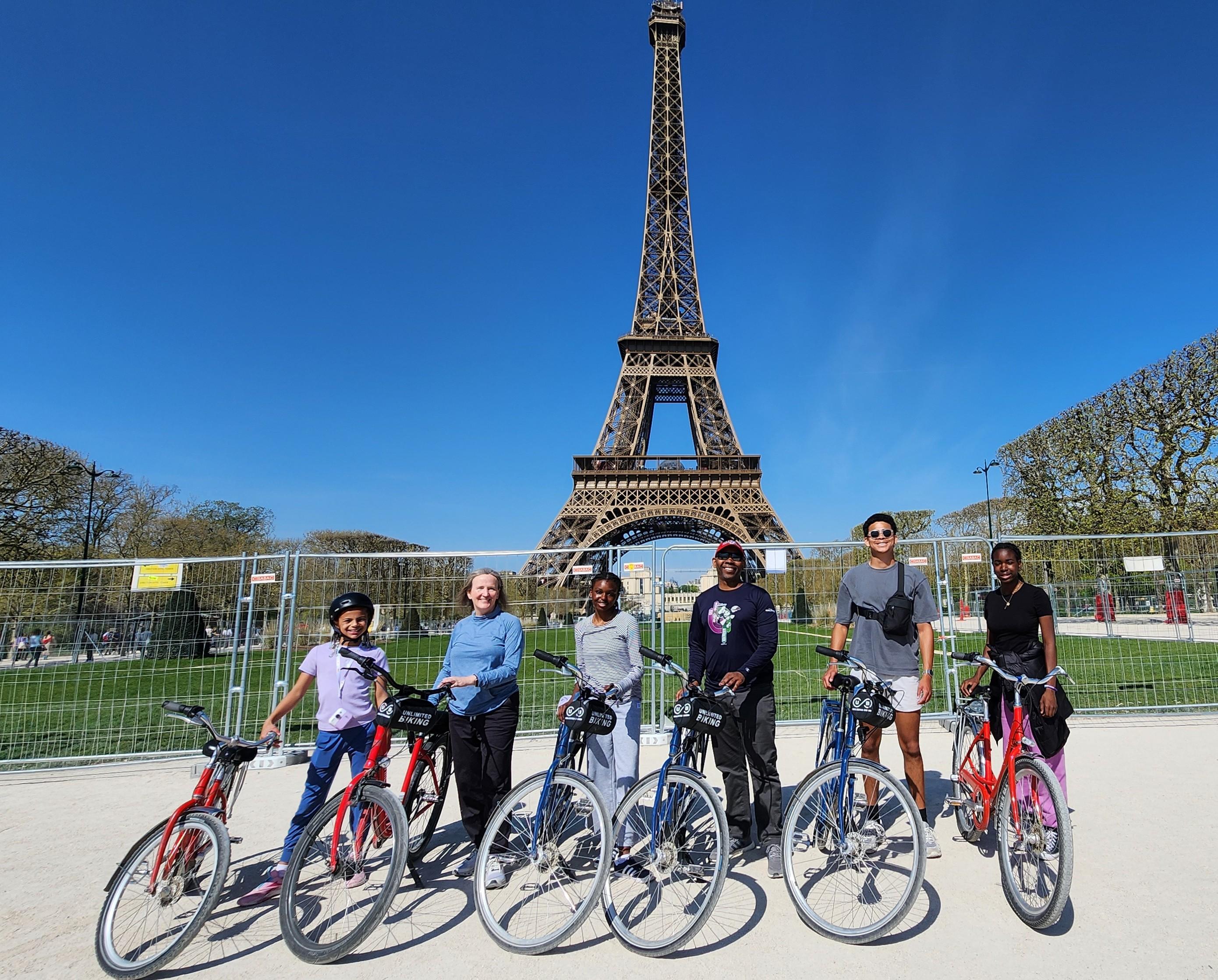 Family group photo in front of the Eiffel Tower